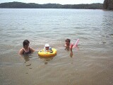 Rachel, mommy, and Grandma Jo playing in the lake.